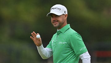 US golfer Brian Harman reacts after making his putt on the 18th green on the opening day of the 152nd British Open Golf Championship at Royal Troon on the south west coast of Scotland on July 18, 2024. (Photo by Glyn KIRK / AFP) / RESTRICTED TO EDITORIAL USE